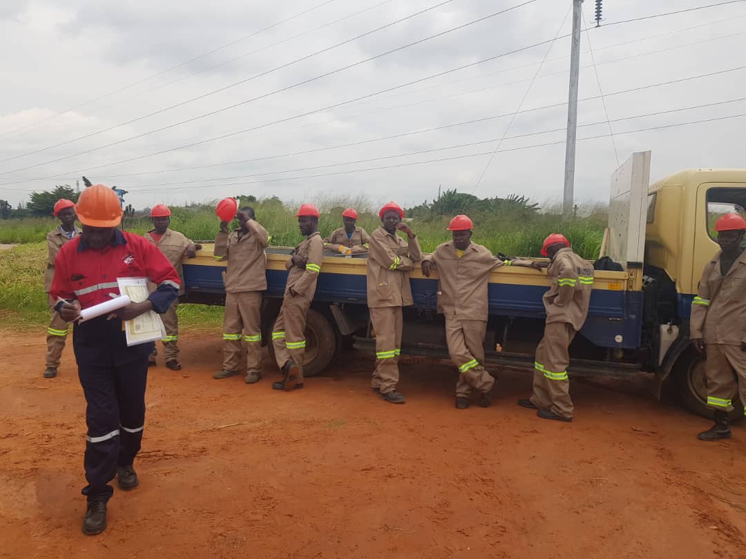 Site safety briefing with crew and truck