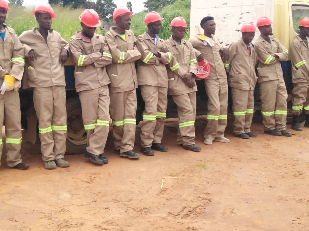 Construction team lineup at job site