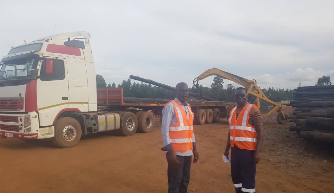 Pole transport truck at logistics yard