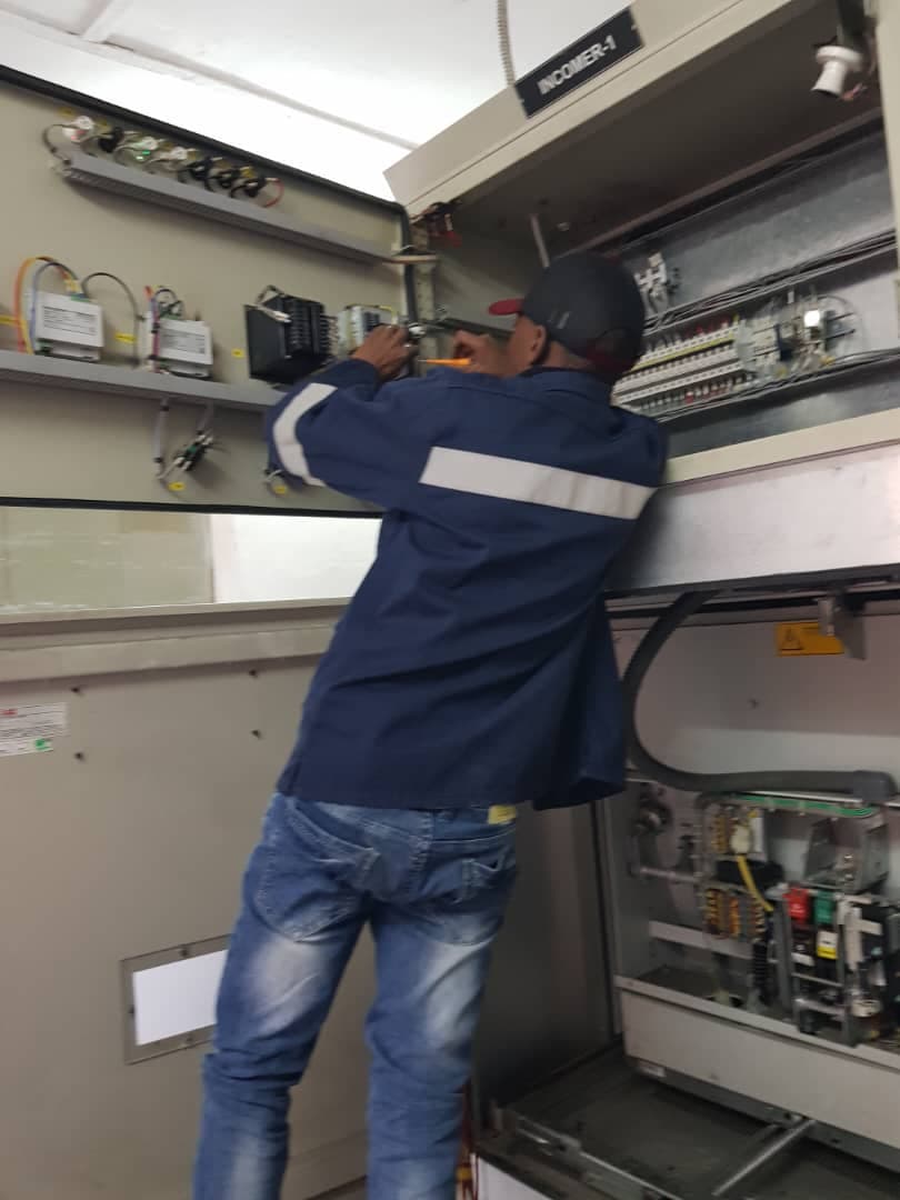 Engineer working on switchgear commissioning
