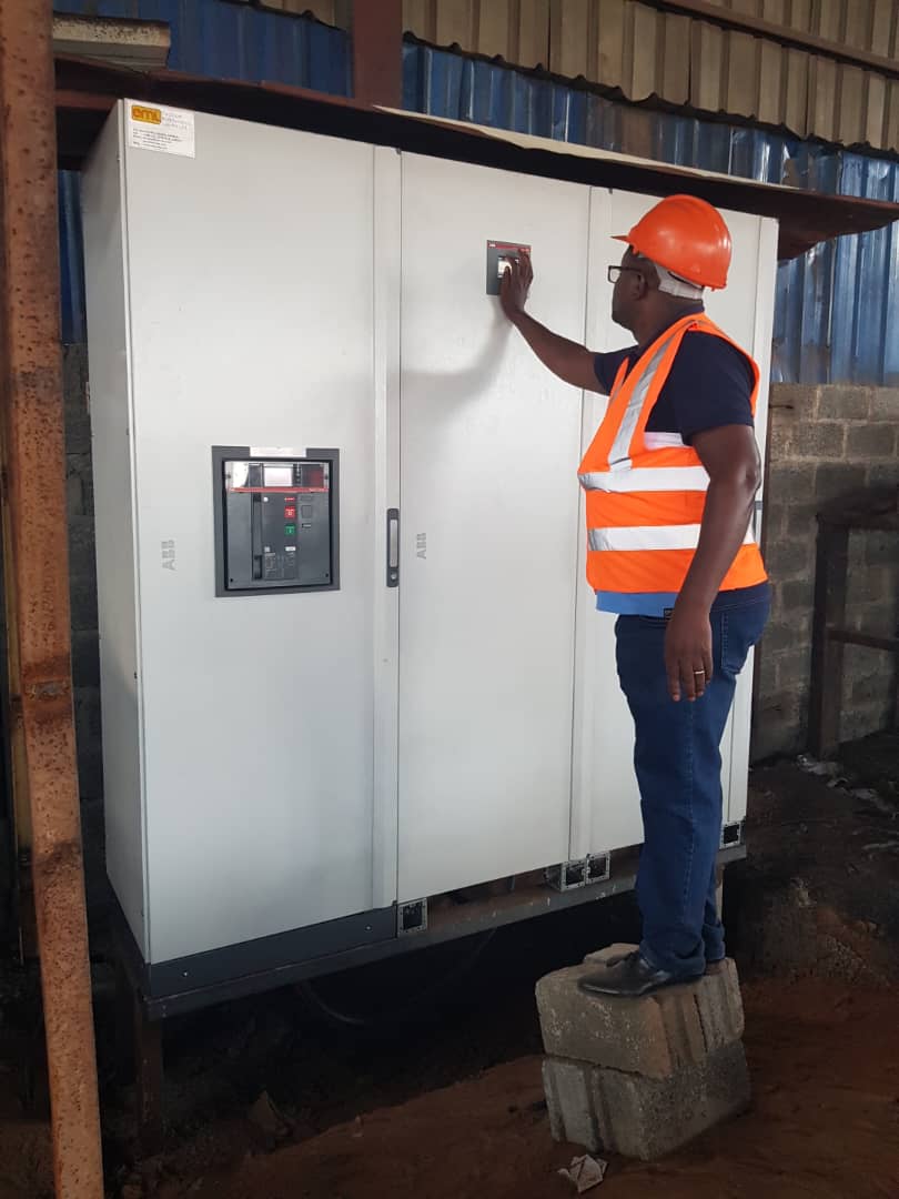 Engineer inspecting ABB switchgear panel